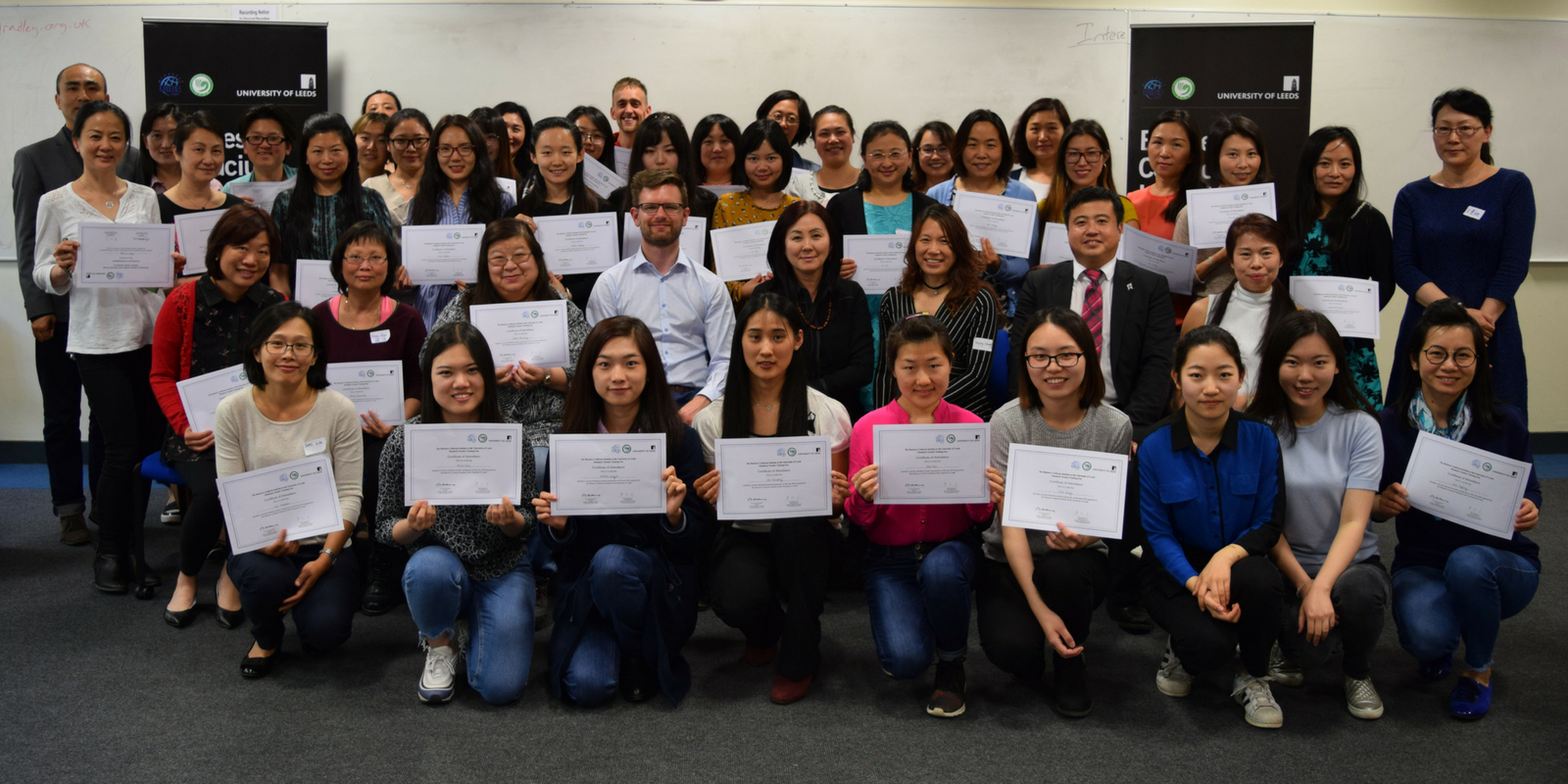 Group photo of trainees with their certificates
