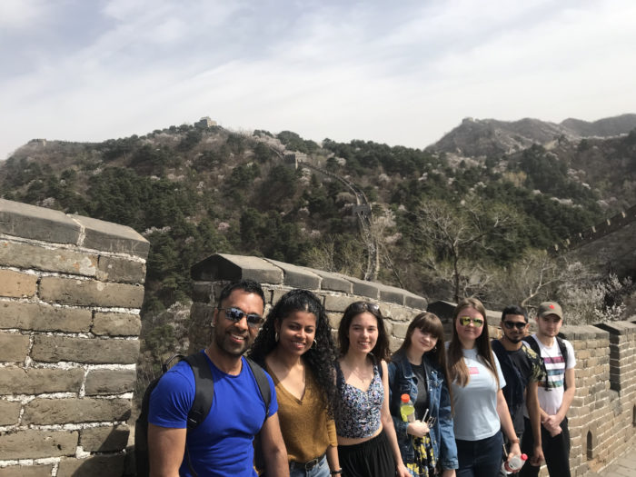 Seven students standing on the Great Wall of China