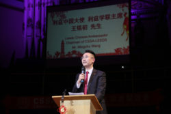 CSSA President Mingchu Wang speaking at the lectern