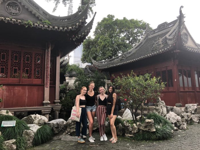 Four young women in a Chinese garden.