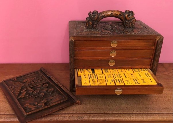 mahjong set in a carved mahogany case